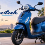 Bajaj Chetak electric scooter parked outdoors showing premium design and LED headlamp.