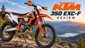 Orange KTM 350 EXC-F enduro motorcycle parked on a rocky mountain trail during sunset.