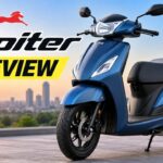 Blue TVS Jupiter scooter parked outdoors for detailed review.