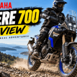 Yamaha Tenere 700 adventure motorcycle riding on a rocky mountain trail during an off-road review.