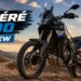 Yamaha Ténéré 700 adventure motorcycle parked on a rugged mountain trail during sunset for a detailed review.